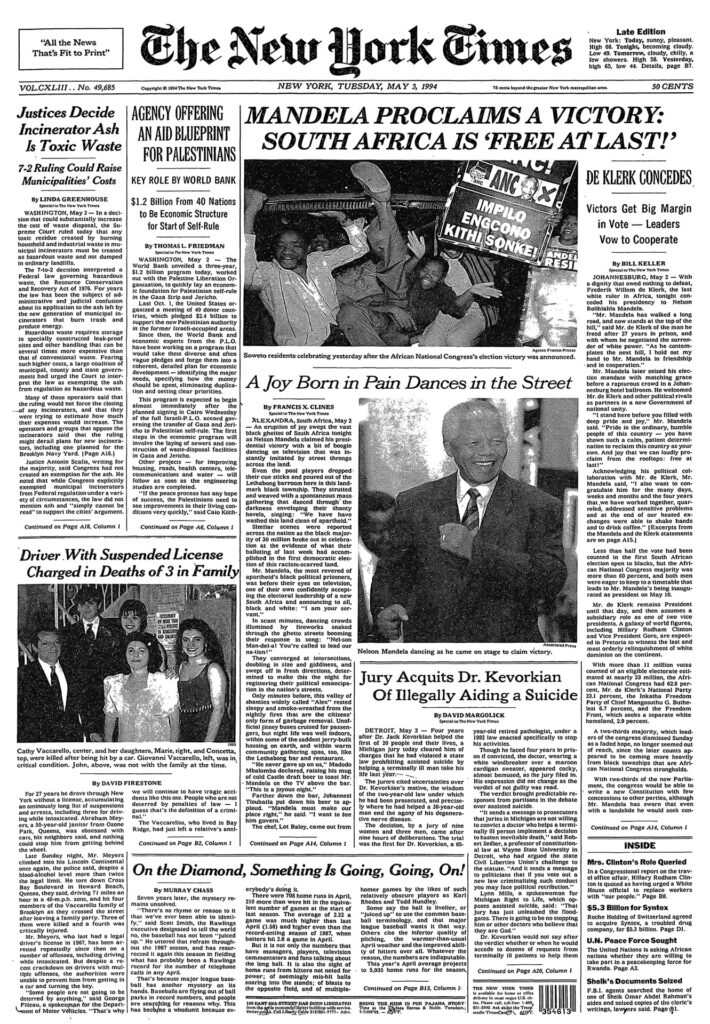 Front page of the New York Times, which features an image of celebrants dancing to news of Mandela’s presidential victory and a center photograph of Mandela himself, participating in the celebration of his victory. The left of the page features a photograph of five members of a family (mother, father, and three children). The title of the article reads “Driver with Suspended License Charged in Deaths of 3 in Family.”